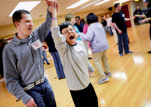 Julia Rendleman/Post-Gazette. 11/22/2015. Tracey Dzurenda, 30, of Baldwin and her dance mentor Brian Fox of North Versailles laugh as they practice their spins during the special needs ballroom dance class Sunday, Nov. 22. "I like the people here and I love Chris," Ms. Dzurenda said of her instructor. Section: Local